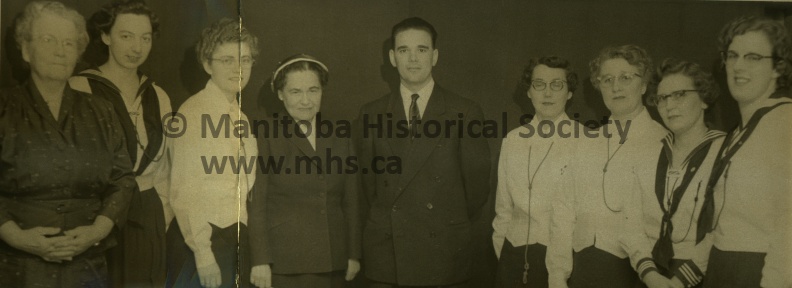 March 3rd, 1956, News, CGIT Group hears talk on immigrants, Miss Louis Mayova, centre, United Church worker at the port of entry of Montreal, was guest speaker at a dedication and affiliation service of Canadian Girls in Training and Explorers at the United Church secretary and active in the CGIT group. Rev. C.L. Barbour, right, was present at the ceremony 11000a.jpg