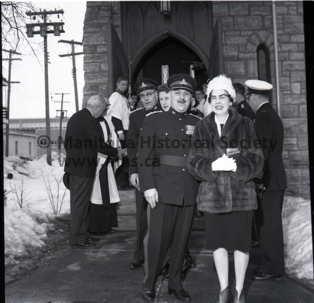 LIEUTENANT-GOVERNOR Errick Willis, attending St. Mary's la Prairie Anglican church here Sunday, greets Chas. E. Cole, right, one of the parishioners. At rear is Rev. D. E. Noonan, rector of the parish. The occasion is one of a number being undertaken by the lieutenant-governor to attend various churches in the province.
PORTAGE MILITIA officers turned out Sunday at St. Mary's la Prairie Anglican church on the occasion of a visit by Lieutenant-Governor Errick Willis, shown at left greeting members of the congregation. In front are Lt. Col. W. Burton and Mrs. Burton, and behind them Capt. O. D. Hancock and Mrs. Hancock of the 26th Field Artillery Regiment (SP) RCA. 1285e.jpg