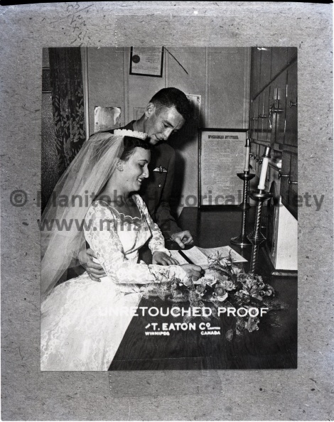 (Eaton's, Copy) July 14/56 Wedding
Sloik - Kelly Wedding
Stella Eleanor Sloik of Portage la Prairie and FO. William Joseph Kelly were united in marriage in the Church of Assumption, July 14. The bride is the youngest daughter of Mrs. Anna Sloik and the late Michael Sloik of Portage la Prairie. 10692a.jpg