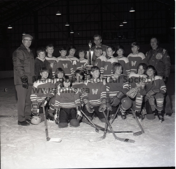 (Tashiro) Feb. 26/72 Minor Hockey
West End Pee Wees Win City and Dist. Group Championships
West End Pee-Wees recently won the city Pee-Wee champions ship by defeating North Side in two straight games in a best-of-three final series. West End won their semi-final in two straight over South Side and compiled a 16-2 record in league play to finish the season in first place. Back row from the left - manager Lorne Henry, Murray Painter, Ron Link, Dale Henry, Darryle Henry, Brian Gair, Richard Kerwin, Jamie Patterson. John Pallister, Kim Fingas and coach Bill Henry. Front row from the left - Mitchell Bell, Steve May, Ricky Whincup, Shane Smith, Dave Bergeron, Adam Pankhurst, Terry Bachalo and Rodney Romyn. 11191a.jpg