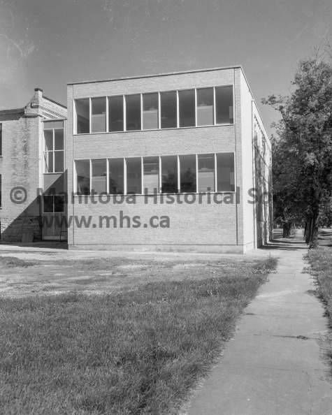 Photographer: Tashiro
August 19, 1957
News
Victoria School, Portage Collegiate Institute - Annexes ready for occupancy
This is an exterior view of part of the eight-room extension now completed at Victoria School. It is modern in every respect and ready for occupancy on September 3. VP-1-00000-001.jpg