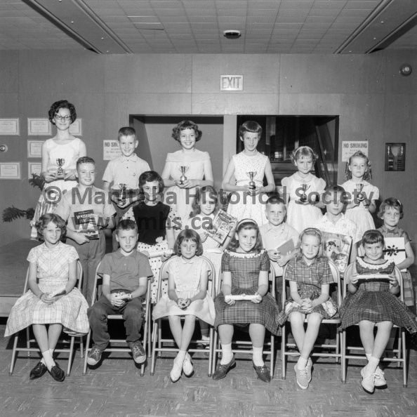 Photographer: Tashiro
June 27, 1962
Educational
Fort la Reine recognition day and winners
The above students were recipients of awards at Fort la Reine school recognition day, Wednesday afternoon. They are, back row, left to right: Bookie Etkin, Allen Tellier, Judy Dutson, Sharon Naugler, Linda Roberts, and Caroline Dyck. Second row: Andrew Mellen, Joy Simpson, Diana James, David McLean, Robert Copeland, and Janice Pallister. Front row: Noreen Kitson, Gillis Tellier, Kathy Heal, Vicki Cool, Debbie Kennedy, and Patti Cool. VP-1-00072-001.jpg