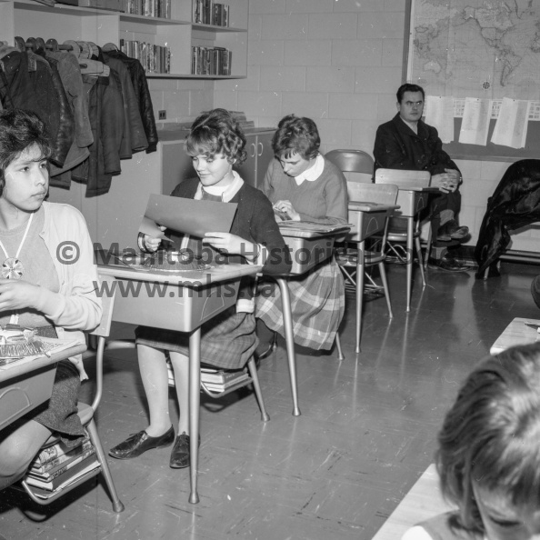 Photographer: Tashiro
March 3, 4, 5, 6, 1964
Education
Education Week observance
Grade Six students at La Verendrye School take a break from the academic course for a bit of relaxation during Education Week open house held on Friday. Working here with scissors are Sigrid Milbradt, left, and Bonnie Hickerson. VP-1-00035-012.jpg