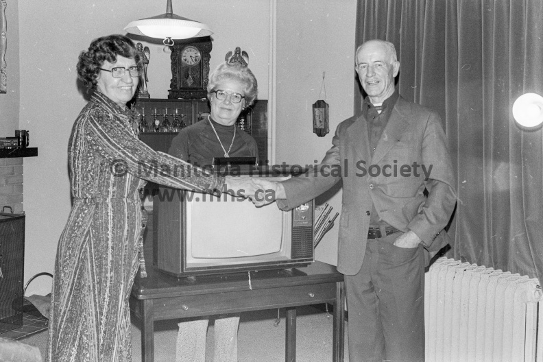 Photographer: Jackson
December 23, 1976
United Way
United Way TV draw winner - Miss Elizabeth Van Deveire
Mr. John Owens, campaign chairman of the Portage Plains United Way Inc. presents the color television to draw winner, Miss Elizabeth Van
Deveire. Mrs. Amie Chesney (back), was the canvasser. VP-2-02003-003.jpg