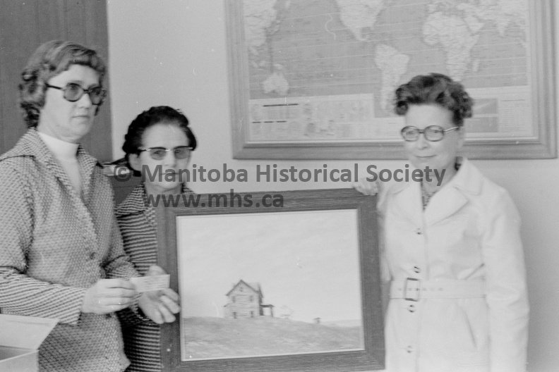 Photographer: Moffat
September 30, 1975
Multiple Sclerosis
Multiple Sclerosis Society Draw
Delta winner
E. Koppen of Delta, is winner of this landscape painting by George Tosczak, formerly of CFB Portage and now of Edmonton who donated it for local charity. Phyllis Moffat, left, secretary of United Way made the draw and holding the picture are Irene Young, treasurer, and Audrey Wilkinson, president of the Multiple Sclerosis Society. VP-2-02073B-002.jpg