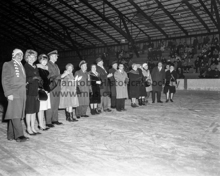 Photographer: Tashiro
March 5, 1965
Recreation Comm
Winter Fun Festival kick-off - Maria Garson crowned queen
Dignitaries from the city, the rural municipality, the RCAF, and from Beausejour were among the more than 800 people at the Arena rink Friday for the opening of Portage’s first Winter Fun Festival. This photo was taken during the introduction ceremonies when the visitors were called to the ice to “take a bow.” VP-1-00521-010.jpg