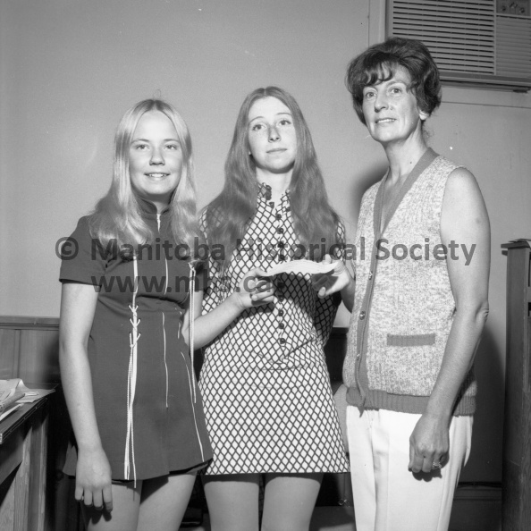 Photographer: Tashiro
June 13, 1972
PCI Red Cross
PCI Red Cross donates $100 to “Miles for Millions”
Nancy Rushton (centre) presents a cheque for $100 on behalf of the Portage Junior Red Cross to Mrs. June Earl, chairman of the Rotary Miles for Million Walk in aid of the school for the blind in St. Lucia. Leaking on at left is Barbara Jensen, also of the Red Cross youth group. VP-1-00688-002.jpg