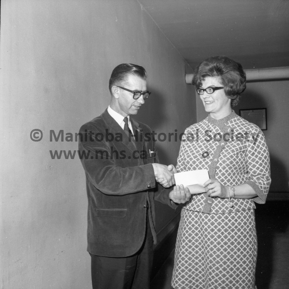 Photographer: Moffat
April 25, 1968
Cancer Society
Canadian Cancer Society Portage Unit - E. A. Marchand Exec-Dir.
The Cancer Society receives a cheque for $375 from the Lady Foresters to help kick off the annual campaign which begins in Portage Monday night with a blitz visit to all city homes by 145 canvassers. Henry Falk, president of the local unit, accepts the cheque from Mrs. Verla Bird, representing the Foresters. The money is proceeds from candy sales conducted by the ladies. VP-1-00645-002.jpg