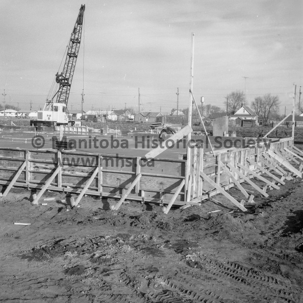 Photographer: Tashiro
November 10, 1961
Educational, Civic Affairs
New north end school construction - Concrete pouring finished
Complete foundation for the new elementary school in the north west of the city was laid in less than a single day, thanks to modern construction. Today workmen were preparing to lay blocks for the main body of the school. Contractors were reported making “excellent progress.” VP-1-00174-002.jpg