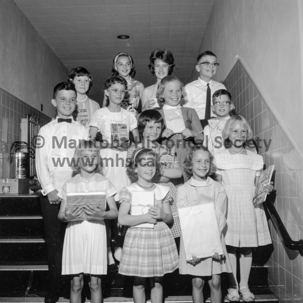 Photographer: Tashiro
June 25, 1964
Education
North Memorial awards
Award winners at North Memorial school this year are shown here: left to right, front row, Beverley Henderson, Rita Antonissen, Elizabeth Warobec; second row, Steven Cyzenyj, Debra Archer, Margaret Wilman, Clarice Cherkas, Linda Tenszen, Louie Antonissen; back row, Donna Whyte, Carol Cress, Nancy Warobec and Roland Neave. VP-1-00187-002.jpg