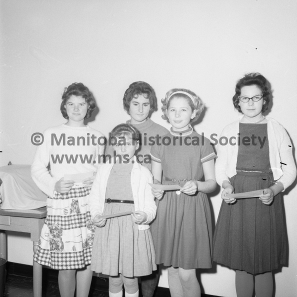 Photographer: Moffat
November 16, 1962
Educational
North Memorial ABC contest winners
ABC of Industry Competition awards were presented at North Memorial School Friday by the principal, Miss Jessie Wallace to winners in the national competition. Shown above are the school’s winners: Carol Sawchuk, Elizabeth Kelly, Dianne Derkatch, Sandra Scarr and Colleen Whyte. Elizabeth Kelly won her award in the junior project, and the remaining four in the handwriting competitions. VP-1-00190-001.jpg