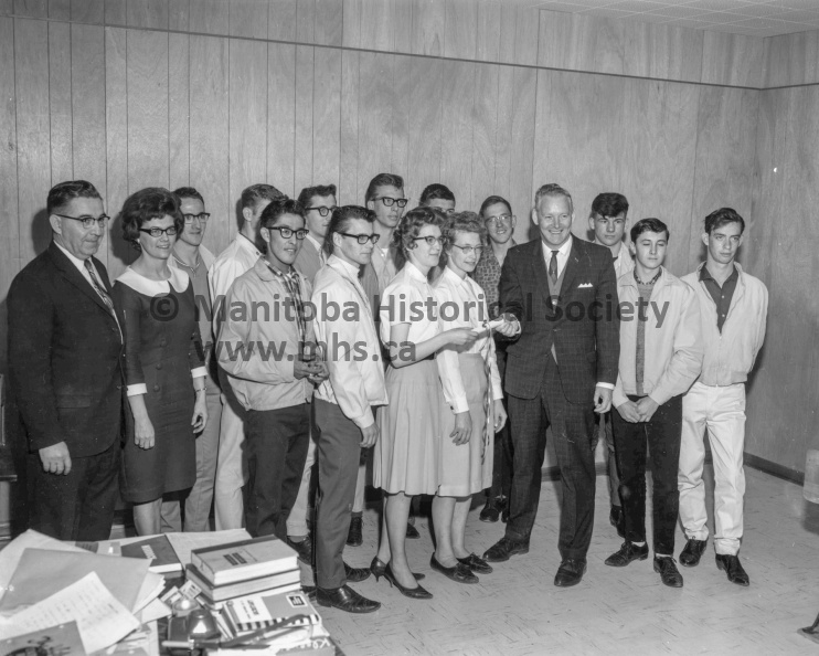 Photographer: Tashiro
May 6, 1966
Educational
National employment service upgrading class - 8 get Grade Ten certificates
Students in the upgrading class conducted in Portage took part this morning in the presentation of certificates. In the group above are, left to right, back row, W. B. Deedo, NES office manager; Mrs. V. Bird, class instructor; Bryan Fox, Steve Piontkowski, John Mellen, Harvey Oakley, Mervin Saranchuk and Bill Cady; centre, Eugene Fortin and Wayne Henry; front, Edwin Beardy, Donald Zalusky, Joyce Rossnagel, Shirley Shield, Jack Ferguson, supervisor of special programs, Manitoba department of education, and Larry Guy. Missing are George Bushby, Warren McIntosh and Trevor Albinet. VP-1-00297-002.jpg
