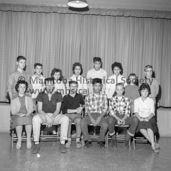 Photographer: Tashiro
October 19, 1961
Social
Vitoria School lit. society
A week of campaigning at Victoria school was climaxed last Friday by the election of officers for the two-year old Literary Society. The officers who were elected are, front row, left to right: Brenda McLeod, Vic Richmond, Clyde Pinkney, editor, Johnny James, president, Dave Cochlan and Alana McIntosh. Back row, left to right, Ken Kushner, Ken McRae, Janice Dyer, Marie Harrison, Walter Cameron, Shirley Woods, Beverly Warantz and John McLeod. Missing from the picture are Dolores Lafreniere, secretary, and Delwyn Bird, treasurer. All students are room representatives except for the president, secretary, treasurer and editor. VP-1-00332-001.jpg