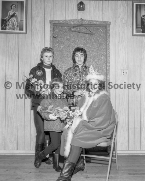 Photographer: Tashiro
February 21, 1965
Social
Southside A.C. - Cathy Davis crowned club queen at annual winter carnival
Southside Queen this year is Cathy Davis, 13, seen here at right with Kathy Simpson who presented the flowers. At back are the princesses, Donna Fotheringham at left, and Wendy McDermid at right. VP-1-00409-003.jpg