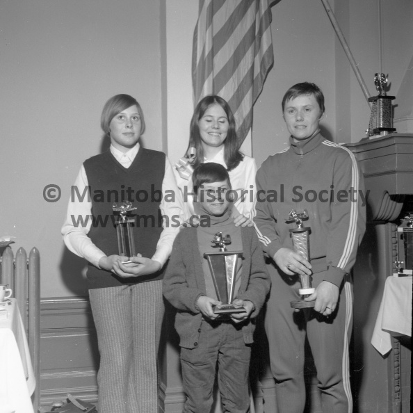 Photographer: Tashiro
March 1-2, 1969
Fun Festival
Fun Festival activities winners
Among power toboggan winners at the Fun Festival during the weekend were, left, Lynne Grant, junior Powder Puff; Judy Cochrane, right, senior Powder Puff; Edmon Caron, in front, under 12s. Standing in centre is Terry Ward, one of the Festival Princesses. VP-1-00495-046.jpg