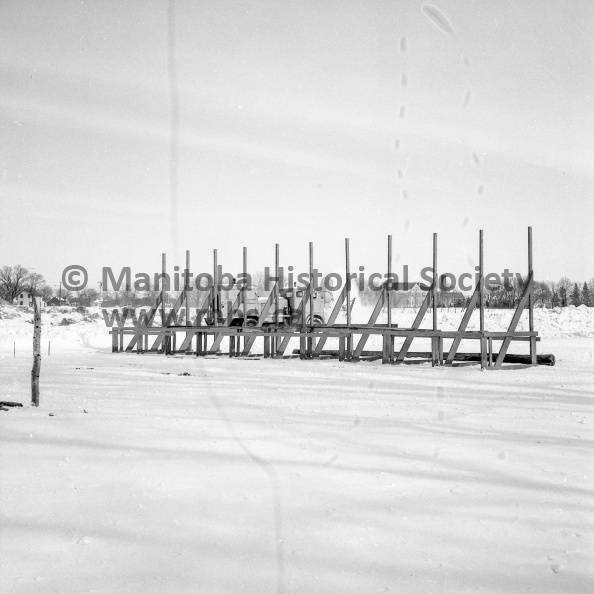 Photographer: Tashiro
February 25, 1969
Fun Festival
Power toboggan track & gates - Snow sculpturing at the best
Starting gates for the power toboggan races stand ready as a blower from CFB Southport cleans the actual track where many of the province's top competitors will test their prowess this weekend at the Fifth Annual Winter Fun Festival. VP-1-00497-001.jpg