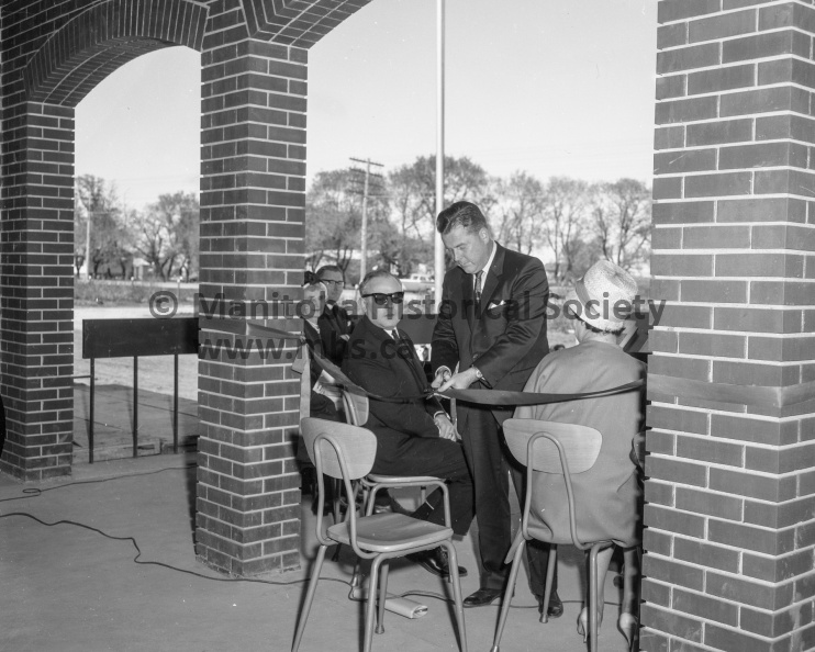 Photographer: Tashiro
May 27, 1966
Educational
Arthur Meighen High School opened - Masons lay corner stone - Hon. Sterling Lyon cuts ribbon
Ribbon cutting to officially open the new Arthur Meighen high school in Portage is carried out by Hon. Sterling Lyon, himself a graduate of the city's high school system. Also shown here is Harold Narvey, chairman of the division school board's building, committee. VP-1-00550-006.jpg