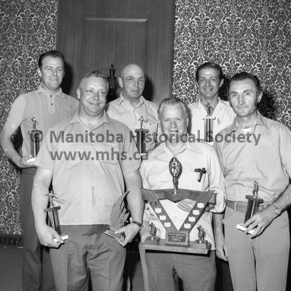 Photographer: Moffat
June 12, 1972
A.N.A.F.
A.N.A.F. bowling champions
Five-pin bowling champions in the Manitoba and North-Western Ontario Provincial Com mand, ANAF, are from the Portage la Prairie unit. Team members include, left to right, back row, Ernie Duchack, Frank O'Reilly, Ron Duchak; front row, Bernie Brunet, who also rolled the high single in the competition, Norm Lunan and Mike Stiegler. Best five scores in each game counted. The Portagers had a pin fall of 4,152, 56 better than runners-up from Rockwood Unit, Winnipeg. The team has qualified to bowl in the ANAF'S Dominion Command play-offs later in the year. VP-1-01067-001.jpg